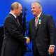 In this photo taken Thursday, June 21, 2012, Russian President Vladimir Putin presents ExxonMobil CEO Rex Tillerson with a Russian medal at an award ceremony of heads and employees of energy companies at the St. Petersburg economic forum in St. Petersburg, Russia. An aide to President Vladimir Putin praised United States President-elect Donald Trump’s choice of Rex Tillerson to lead the State Department and says that the businessman is well regarded by many Russian officials. 